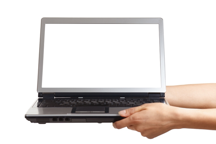 Hands are holding an open laptop computer with white screen