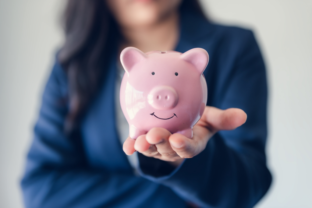 Holding a piggy bank